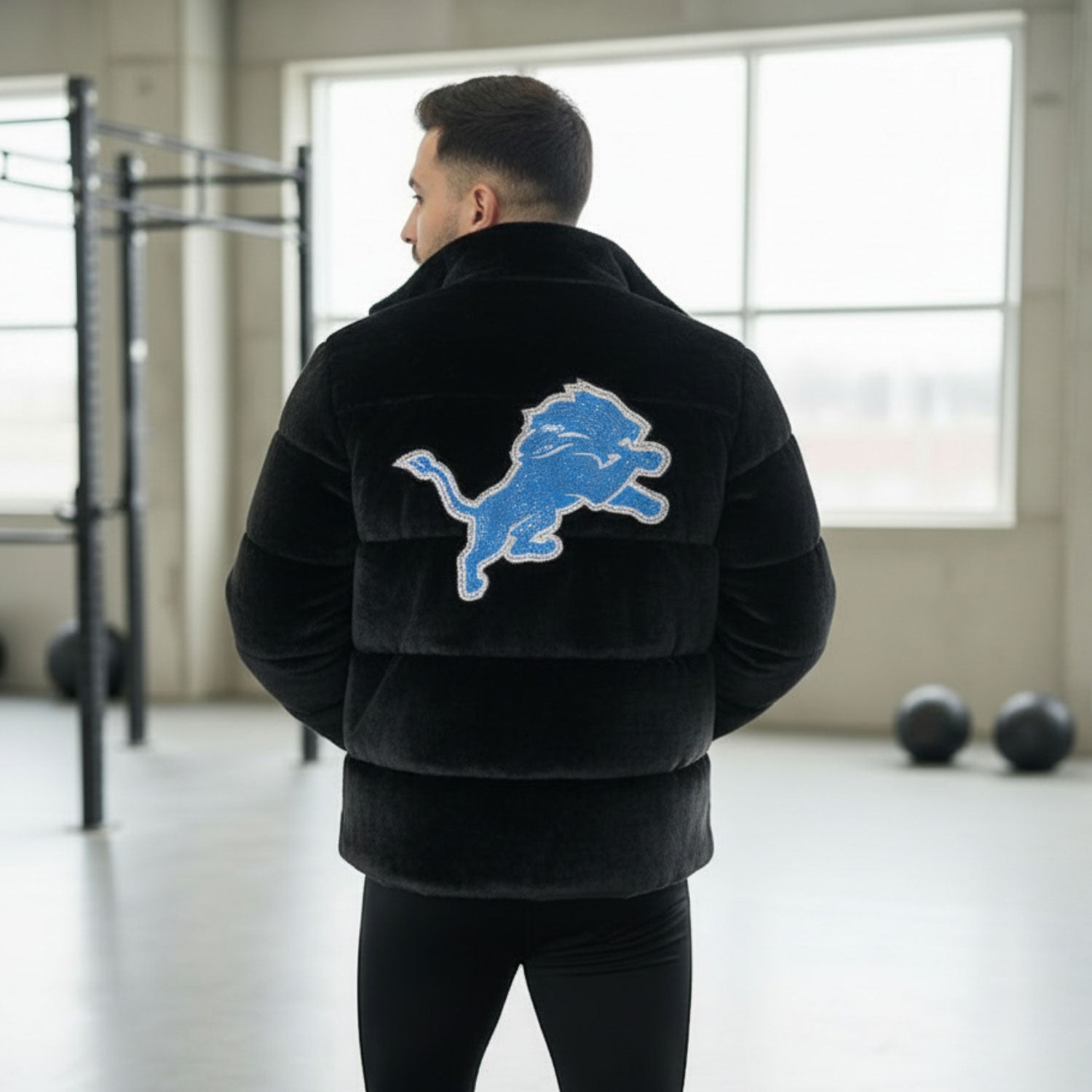 Back view of UKRA black fur jacket featuring large blue tiger patch