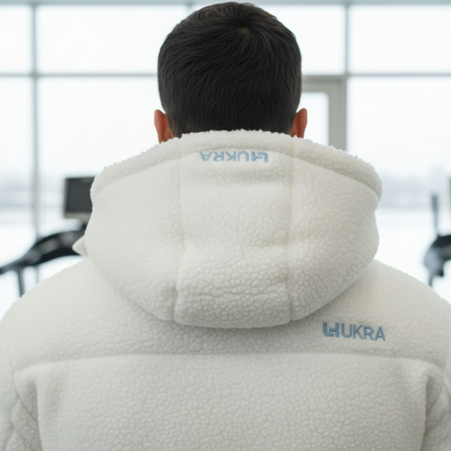 Back view showing embroidered UKRA logo on hood and back.